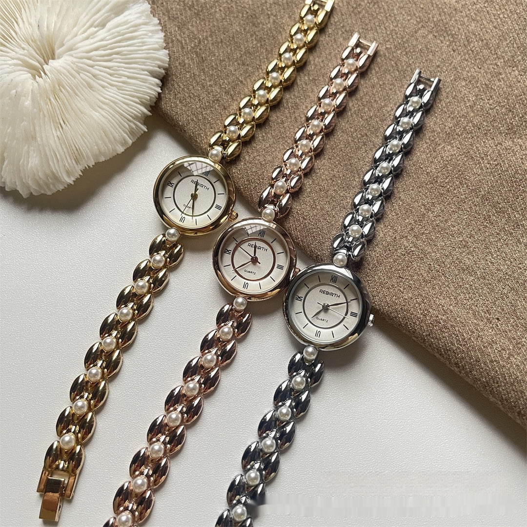 Montre-bracelet pour femme avec bracelet métallique et perles