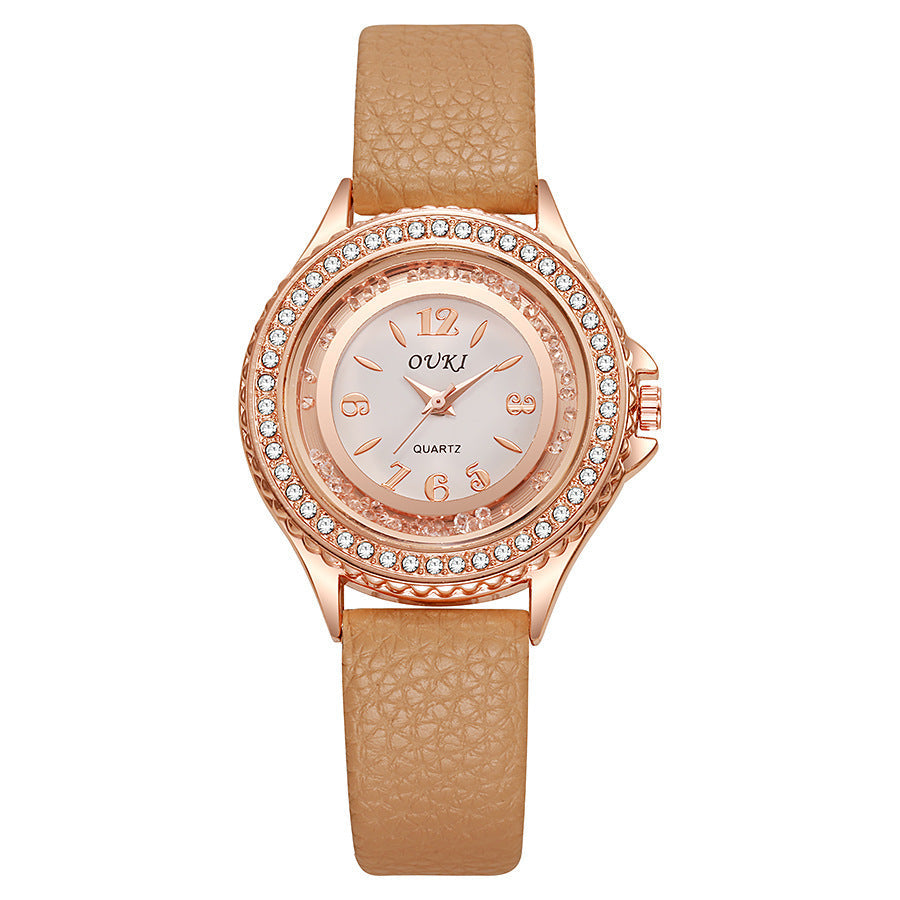 Montre femme ronde avec lunette en cristal