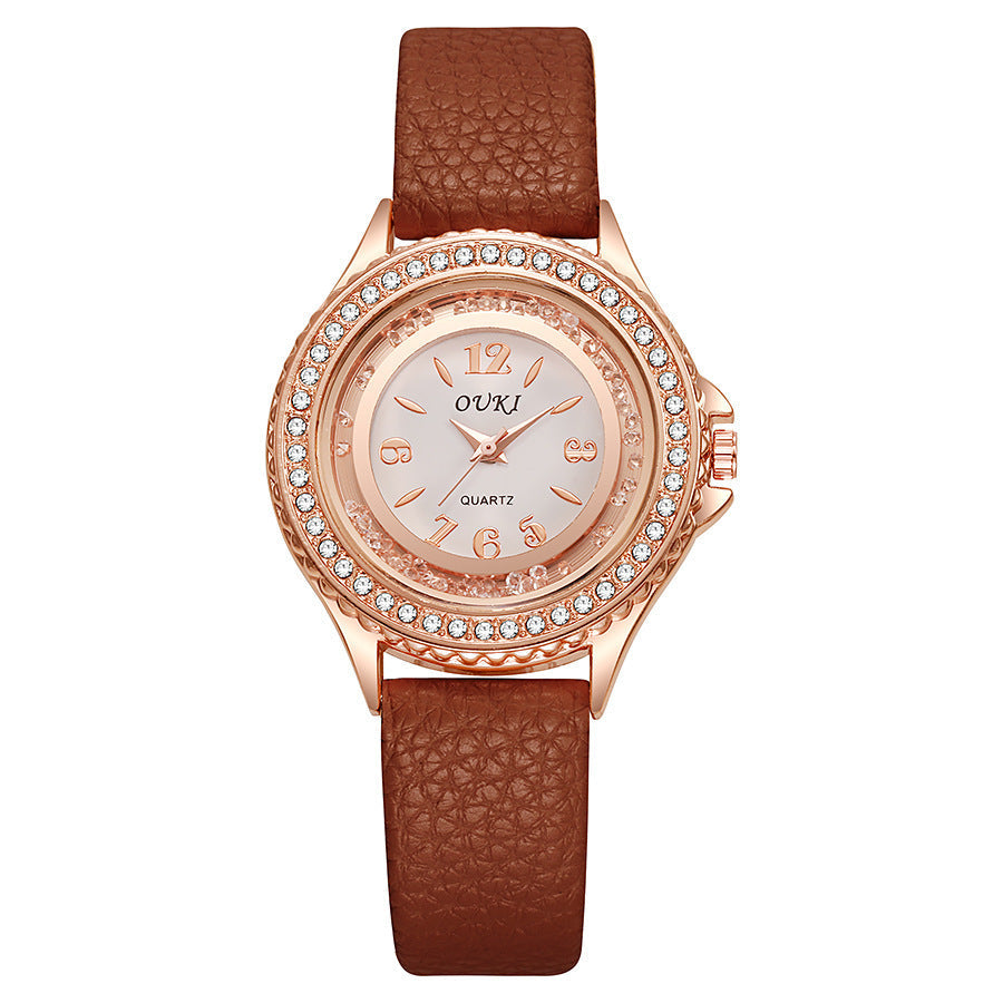 Montre femme ronde avec lunette en cristal