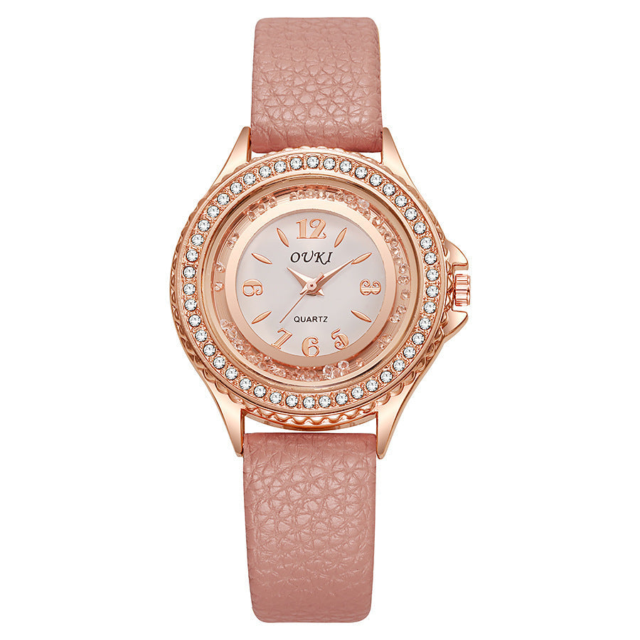 Montre femme ronde avec lunette en cristal