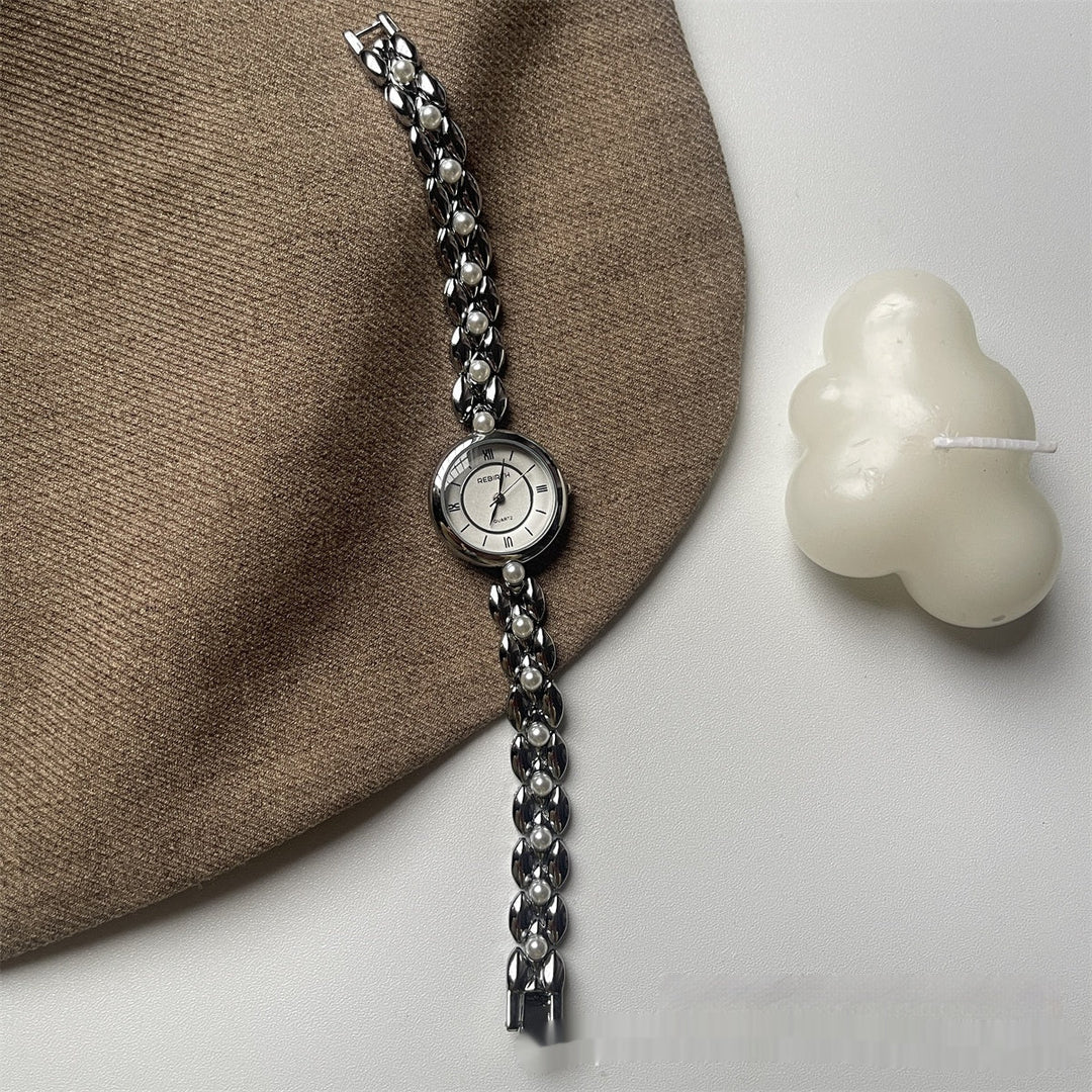 Montre-bracelet pour femme avec bracelet métallique et perles